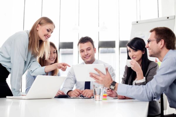 A group of people sitting around a table.